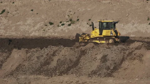 Scraper machine at work to level the river bed 動画素材 154875964