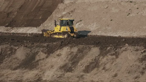 Scraper machine at work to level the river bed 動画素材 154884124