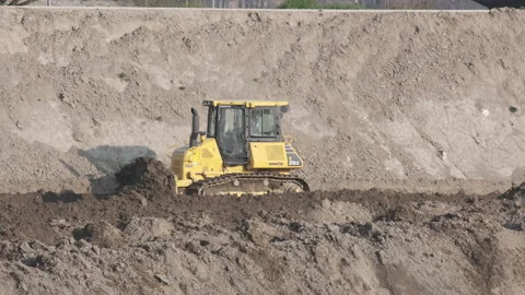 Scraper machine at work to level the river bed 動画素材 154884604