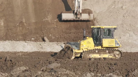 Scraper machine at work to level the river bed 動画素材 154885405