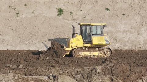 Scraper machine at work to level the river bed 動画素材 154885426