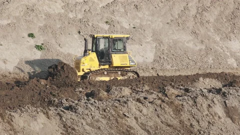 Scraper machine at work to level the river bed 動画素材 154885926