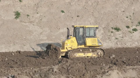 Scraper machine at work to level the river bed 動画素材 154888040