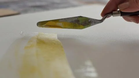 A scraper put color on an easel Stock Photos