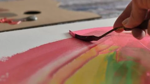 A scraper put color on an easel Stock Photos