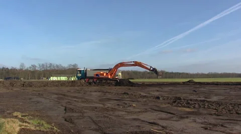 Scraping arable land for bringing back heath landscape - wide shot Stock Footage 31516188