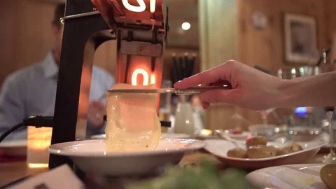 Scraping authentic fondue cheese Stock Footage 69993649