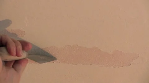 Scraping bad old paint from ceiling wall with a putty knife (closer) Video stock 58773703