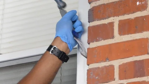 Scraping Brick Near Window Stock Footage 89298245
