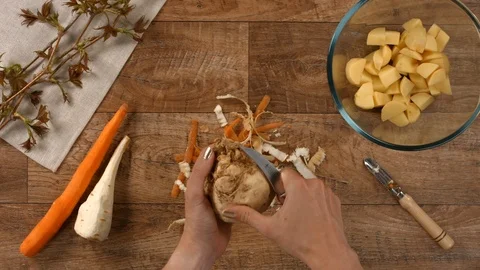 Scraping celery for cooking soup Stock Footage 103465499