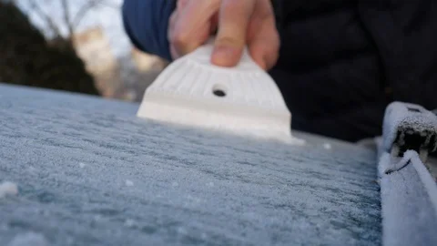 Scraping ice and snow from the car Stock Footage 101461438