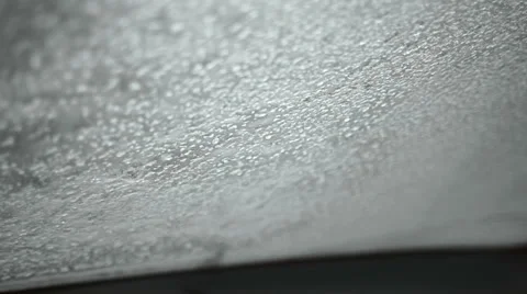 Scraping Ice off a Car Windshield Stock Footage