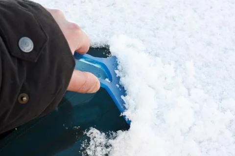 Scraping ice off windscreen Stock Photos