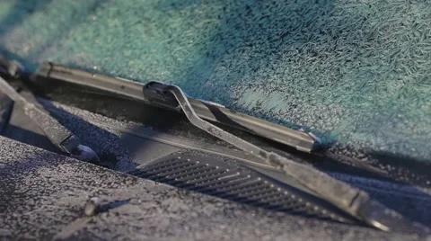 Scraping ice from a windshield close up Stock Footage 44352319