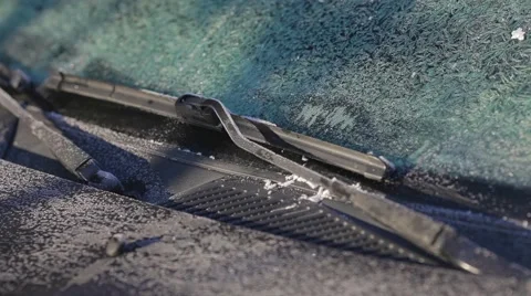 Scraping ice from a windshield close up Stock Footage 44352360