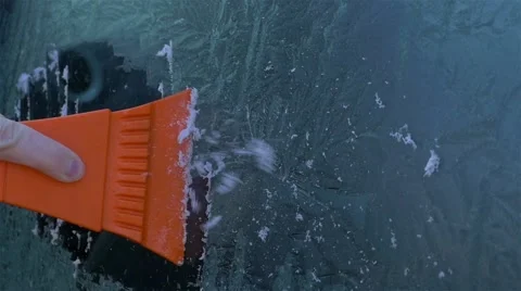 Scraping ice from windshield Stock Footage 60774103