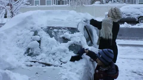 Scraping snow from the windshield Stock Footage 11633783
