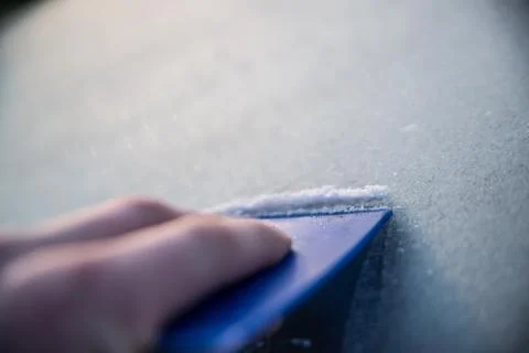 Scraping windscreen during winter Stock Photos