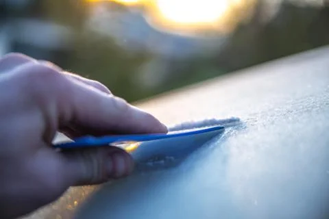 Scraping windscreen during winter Stock Photos