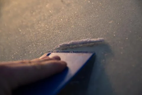 Scraping windscreen during winter Stock Photos