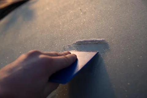 Scraping windscreen during winter Stock Photos