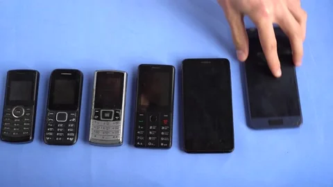 Scrapped old broken obsolete outdated non-working mobile phones, smartphones Stock Footage 144806950