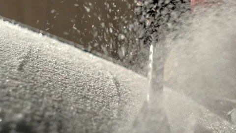 Scrapping Ice of a Car Windshield in the Dark Hours of the Morning in Slow Stock Footage 93671544