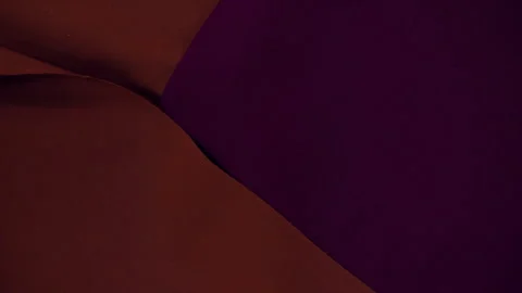 Scraps of different bright multi-colored fabrics are placed on the table. top Stock Footage 240986716