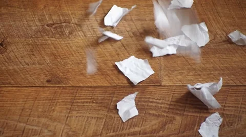 Scraps of paper fall to the floor Video stock 35121608