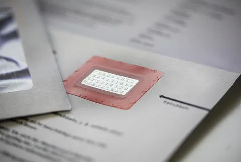 Scratch-off panel or label covering credit card PIN Stock Photos