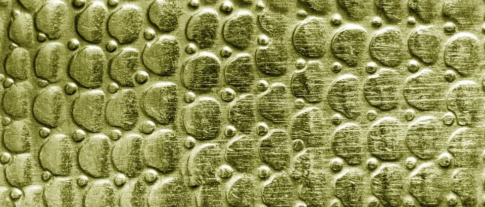 Scratched golden texture with round pattern. Abstract metallic background. Foto stock