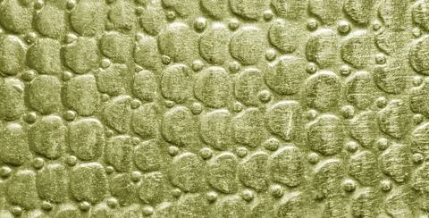 Scratched golden texture with round pattern. Abstract metallic background. Stock Photos