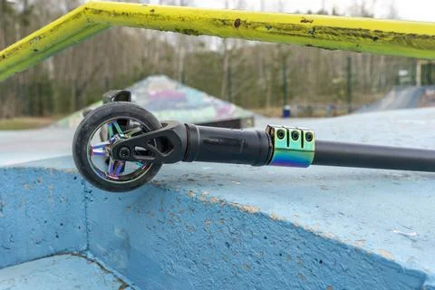 The scratched scooter lies after falling to the ground Stock Photos