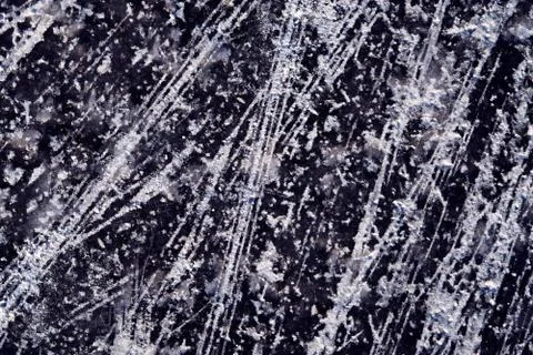 Scratched surface of dark ice texture. Abstract background. Monochrome textur Stock Photos