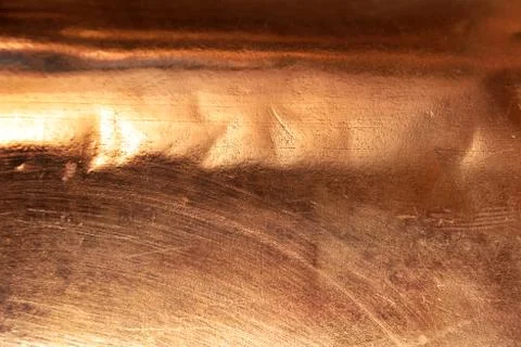 Scratched texture copper plating background close-up Stock Photos