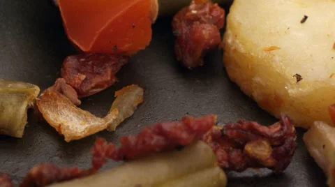 Scratching pan teflon surface with a fork while mixing vegetables Stock Footage 36912890