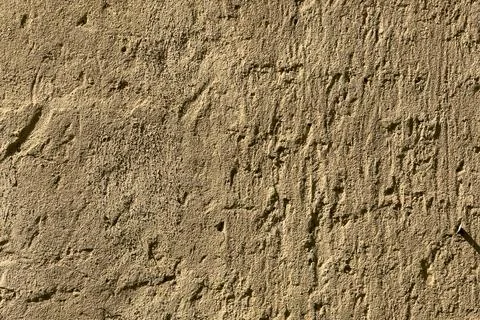 Scratchy stucco wall surface makes textured background plate Stock Photos