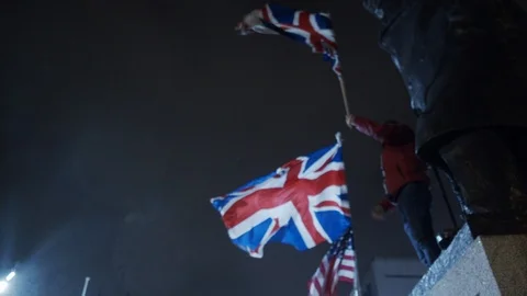 Screaming Brexit while waving UK flag Stock Footage 123952548
