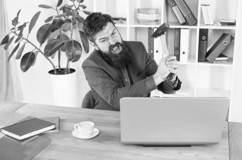 Screaming. fix some business problems. Computer lag virus. angry businessman or 库存照片