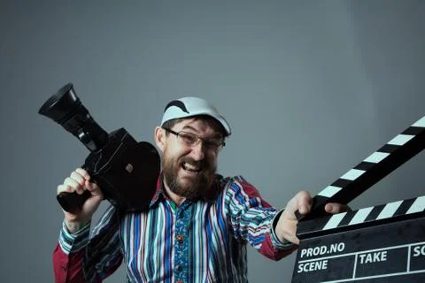 Screaming man retro movie camera and clapperboard Foto stock