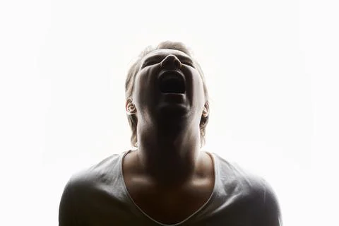 Screaming Man in studio isolated white background. Emotion boy Stock Photos