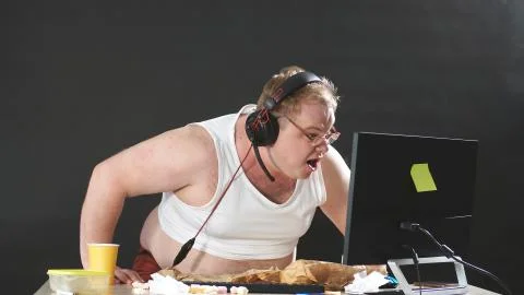 Screaming person while playing a video game on a computer, a person is having Stock Photos