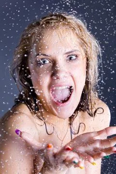 Screaming woman with falling water droplets Stock Photos