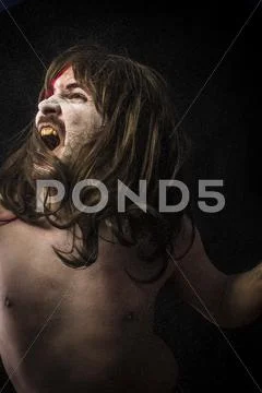 Scream.savage warrior with iron sword Stock Photos