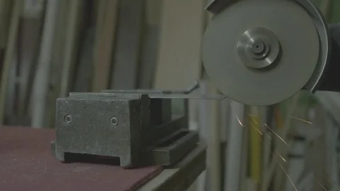 Screeching disk of the angle grinder sinked into the metal. Stock Footage 73255901