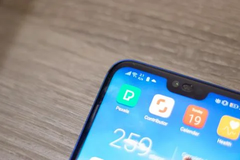 Screen of an android device with Pexels and Shutterstock contributor app icon Stock Photos