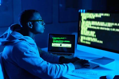 Screen, black man or hacker coding on computer for cybercrime, malware or Stock Photos