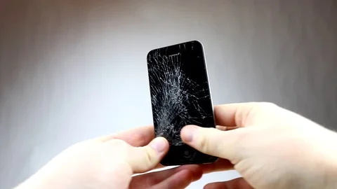Screen broken smartphone. Cracked Iphone 4. Stock Footage 72454472