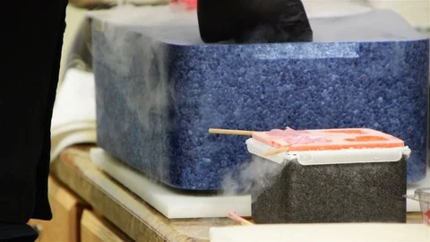 An off screen chef prepares special candied treats using liquid nitrogen Stock Footage 93514462