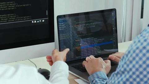 Screen Coding Programmer woman writing program HTML code sitting at workplace in Stock-Footage 334586138